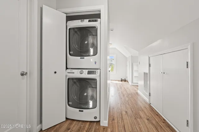 a view of a hallway with washer and dryer