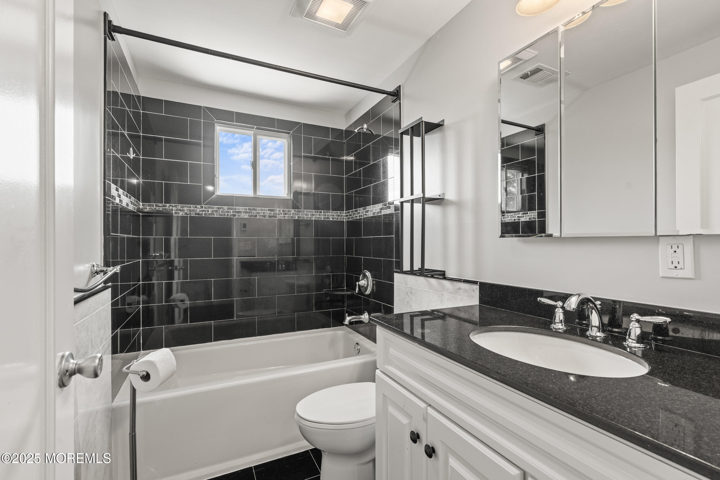 324 Cedar Avenue Elberon, NJ 07740 - Photo 24 of 25 a bathroom with a sink a toilet and bathtub