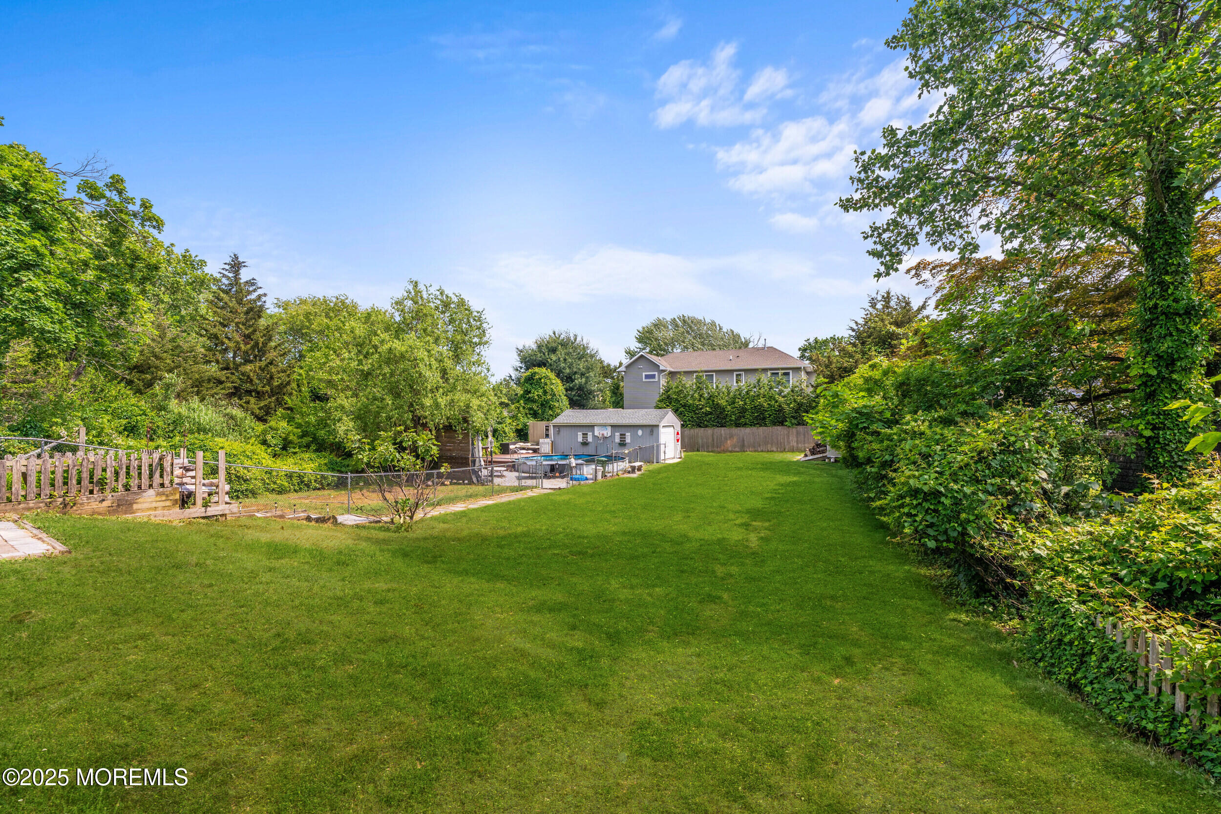 324 Cedar Avenue Elberon, NJ 07740 - Photo 3 of 25 a view of a golf course with a garden