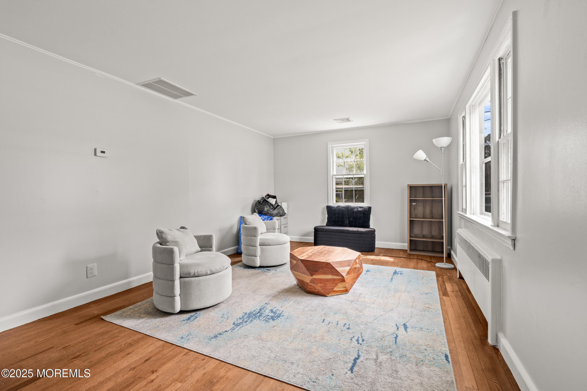 324 Cedar Avenue Elberon, NJ 07740 - Photo 7 of 25 a living room with furniture and a wooden floor