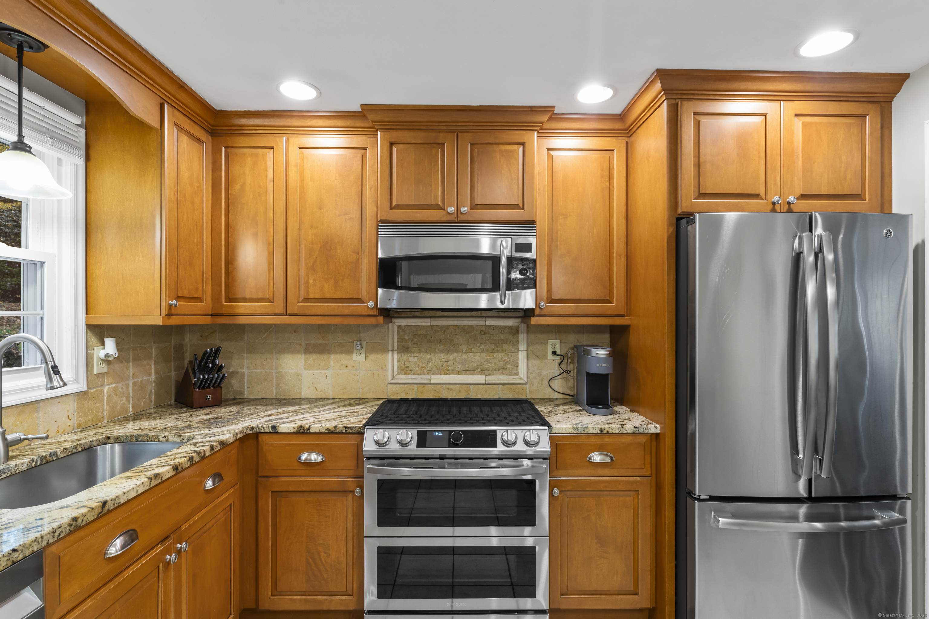 8 Possum Ridge Road Newtown, CT 06470 - Photo 16 of 38 a kitchen with a stove a refrigerator and a sink