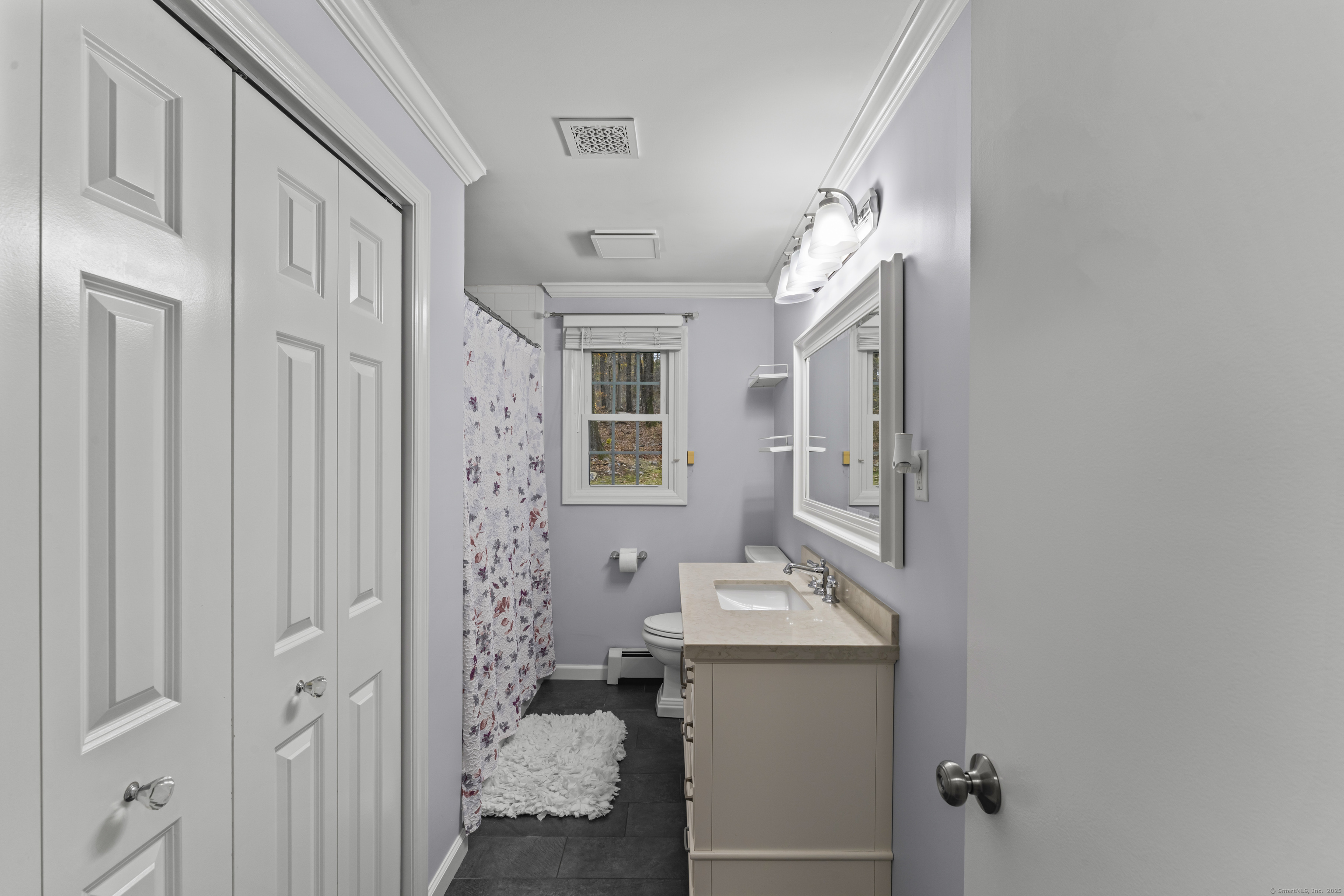 8 Possum Ridge Road Newtown, CT 06470 - Photo 19 of 38 a bathroom with a sink a mirror and shower