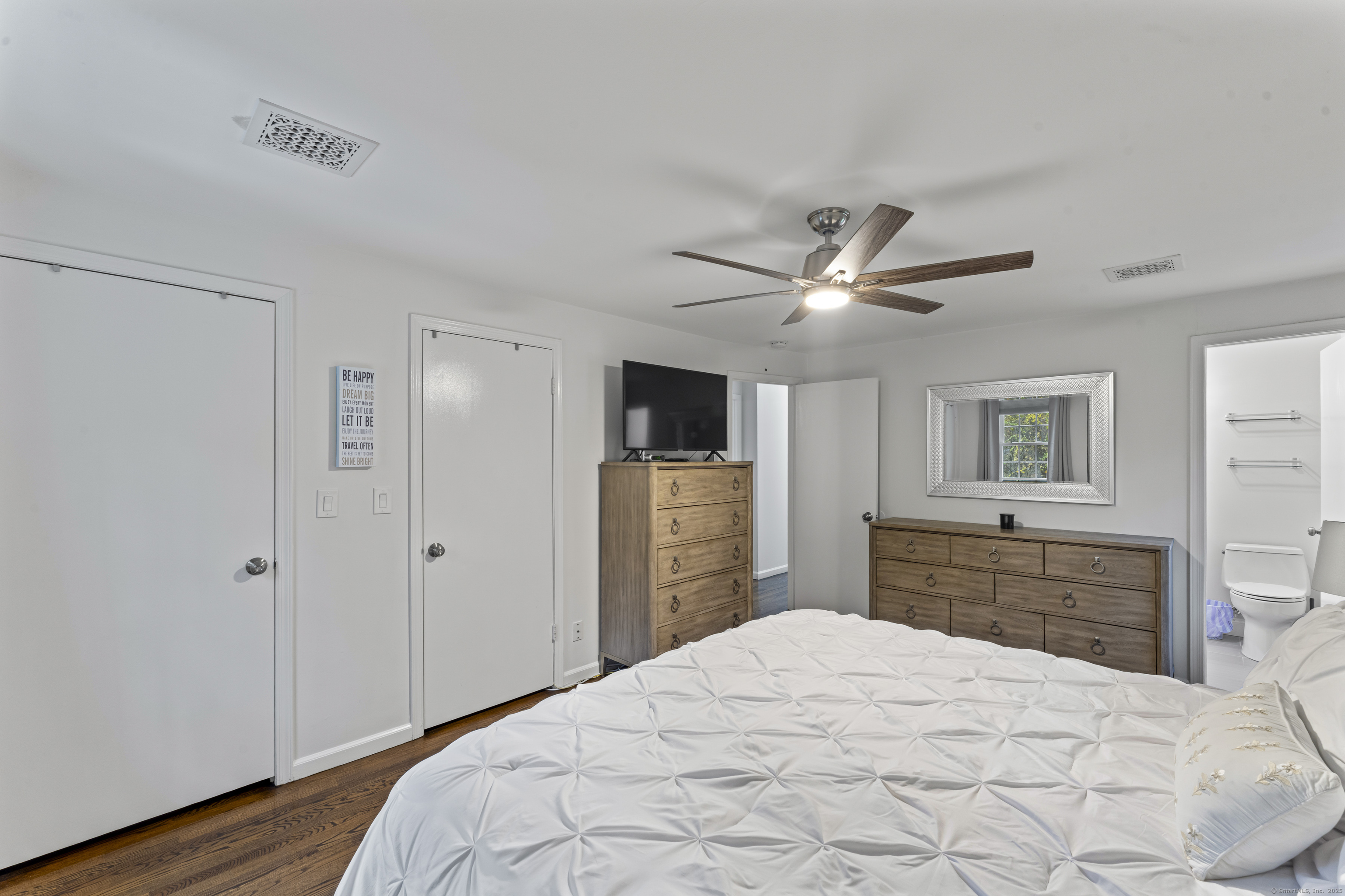 8 Possum Ridge Road Newtown, CT 06470 - Photo 23 of 38 a bedroom with a bed and a flat screen tv