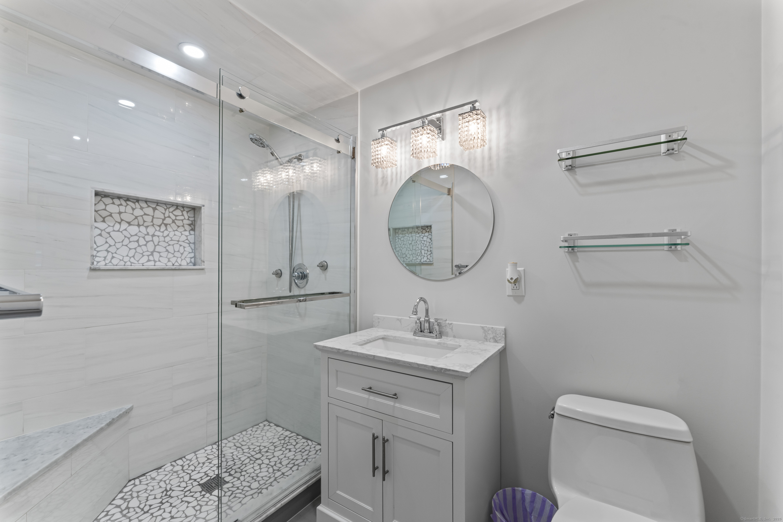 8 Possum Ridge Road Newtown, CT 06470 - Photo 24 of 38 a bathroom with a toilet a sink and a mirror