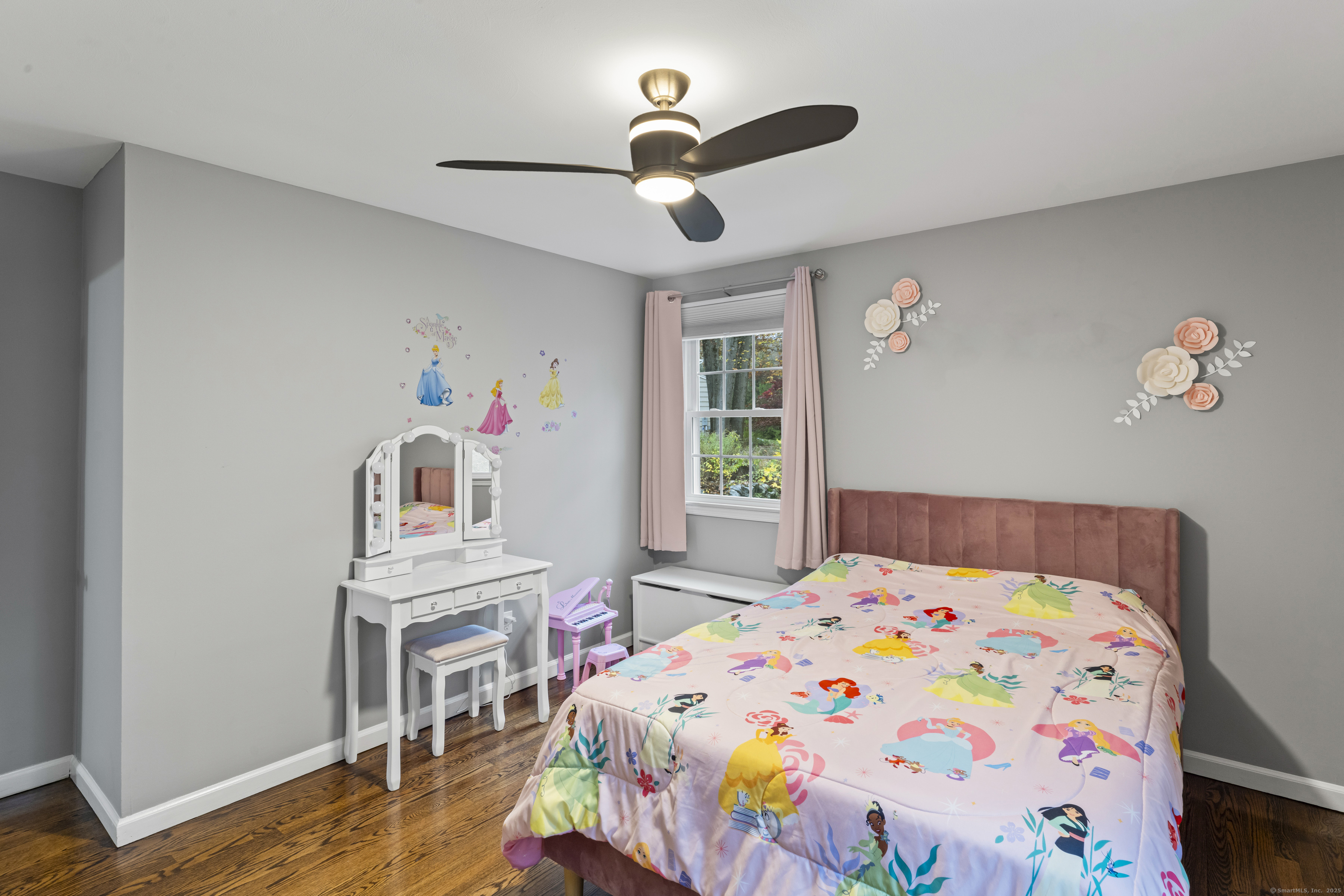 8 Possum Ridge Road Newtown, CT 06470 - Photo 27 of 38 a bedroom with a bed and a chandelier