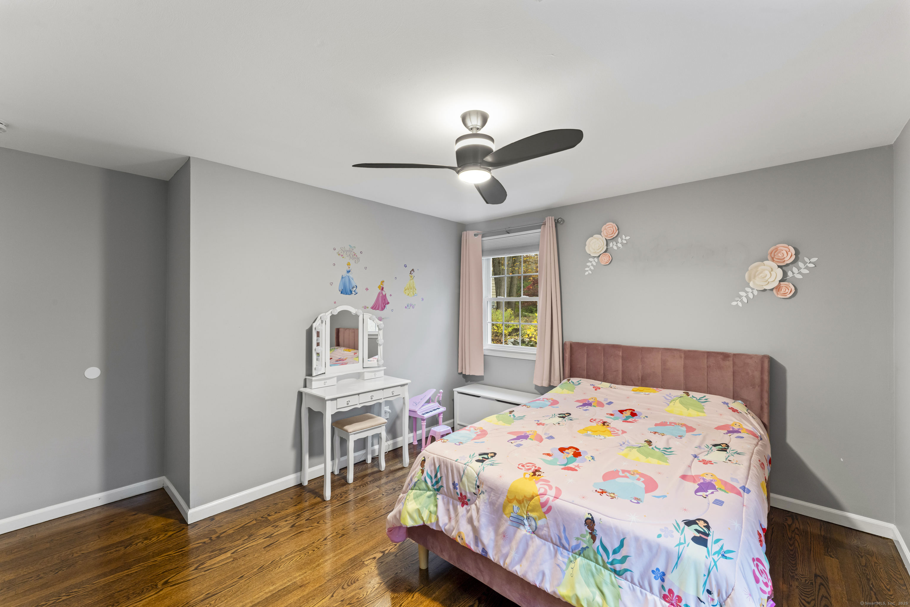 8 Possum Ridge Road Newtown, CT 06470 - Photo 29 of 38 a bedroom with a bed and a chandelier