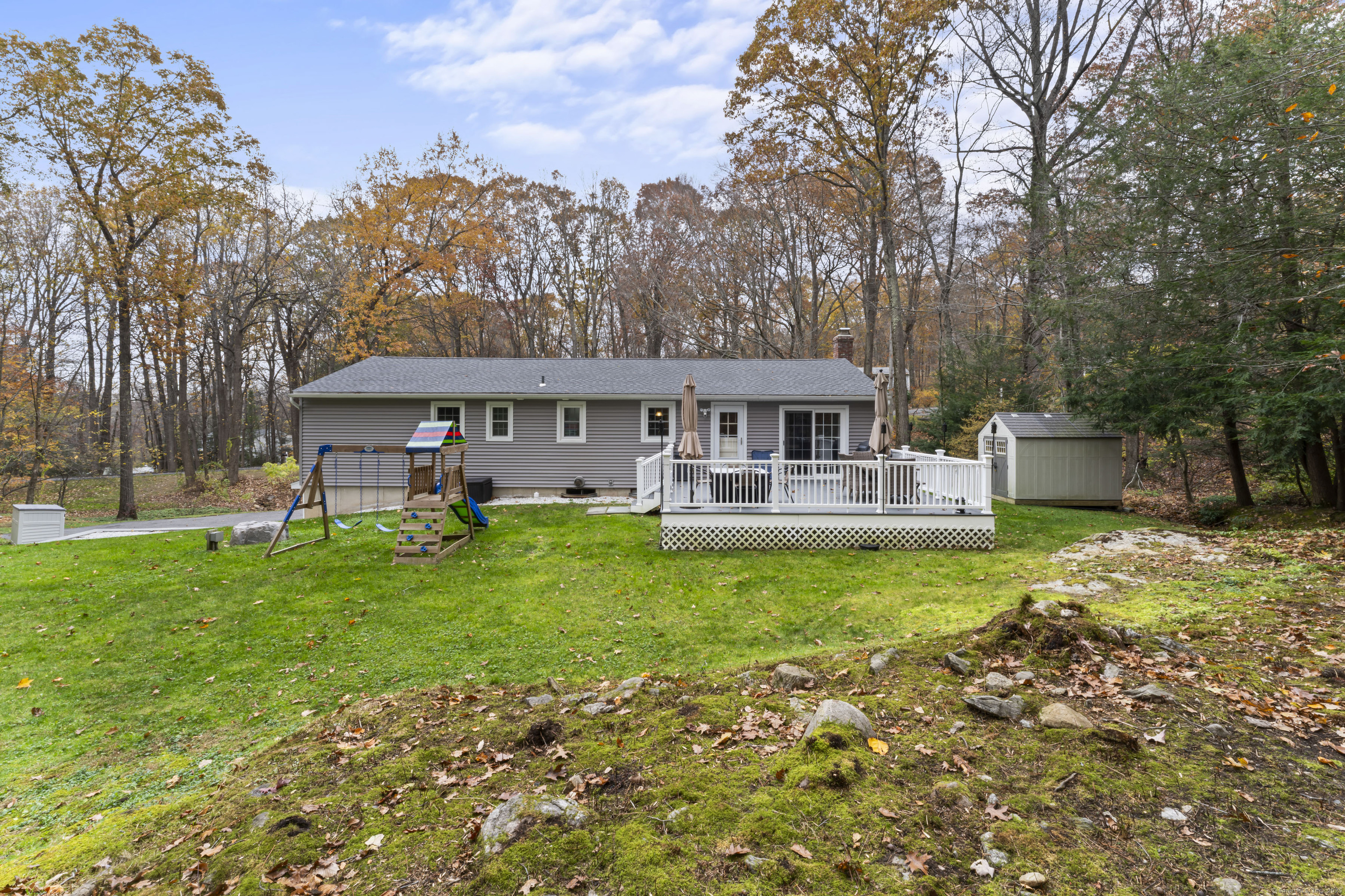 8 Possum Ridge Road Newtown, CT 06470 - Photo 3 of 38 front view of a house with a big yard
