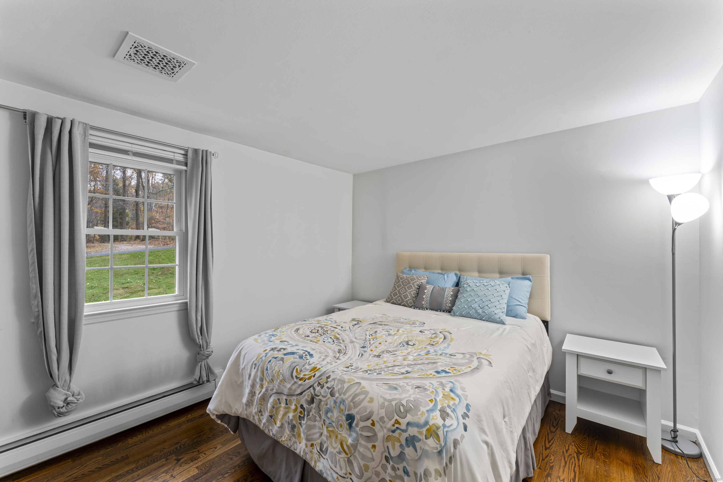 8 Possum Ridge Road Newtown, CT 06470 - Photo 31 of 38 a bed sitting in a bedroom next to a window