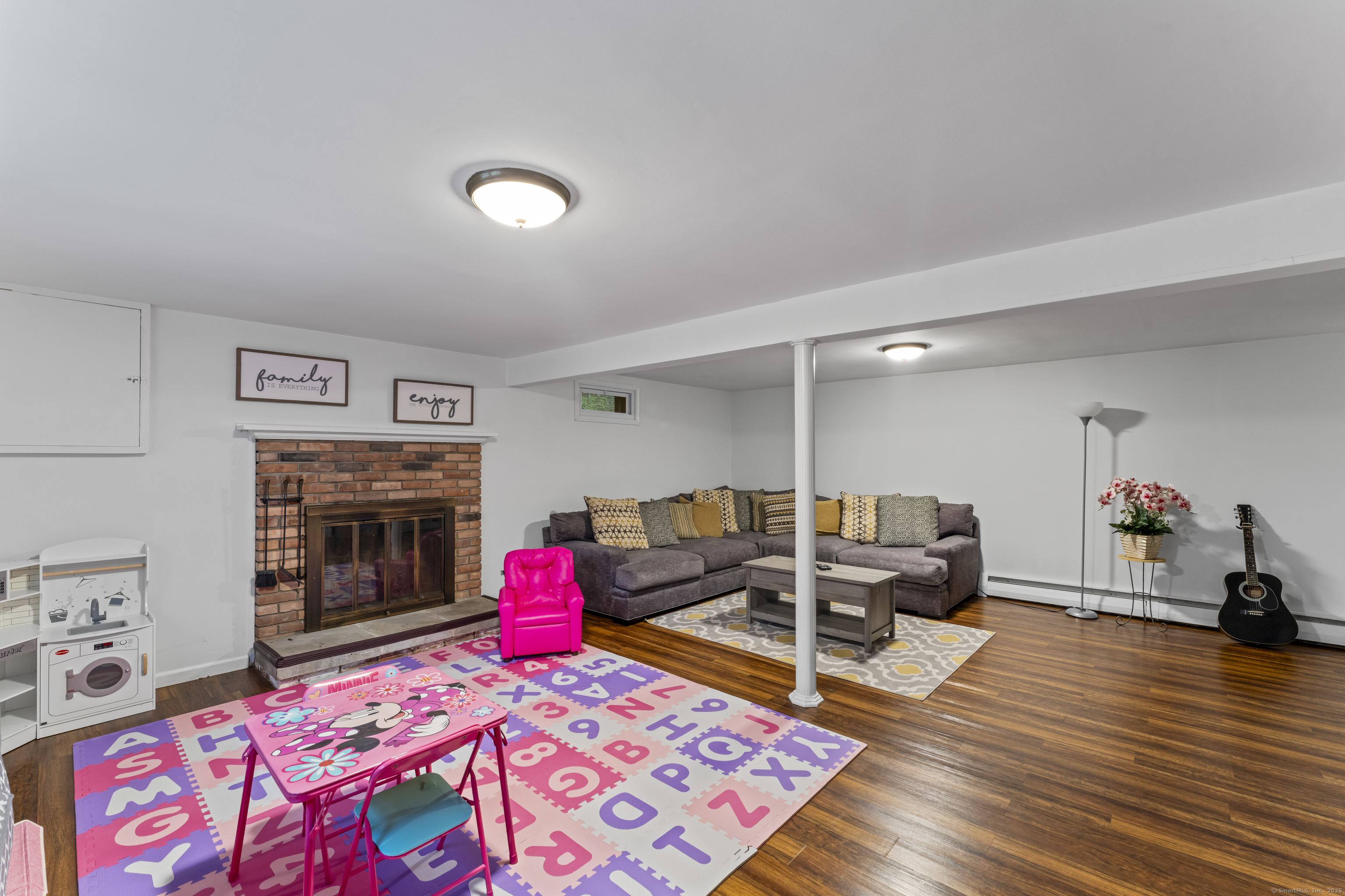 8 Possum Ridge Road Newtown, CT 06470 - Photo 33 of 38 a living room with furniture and a fireplace