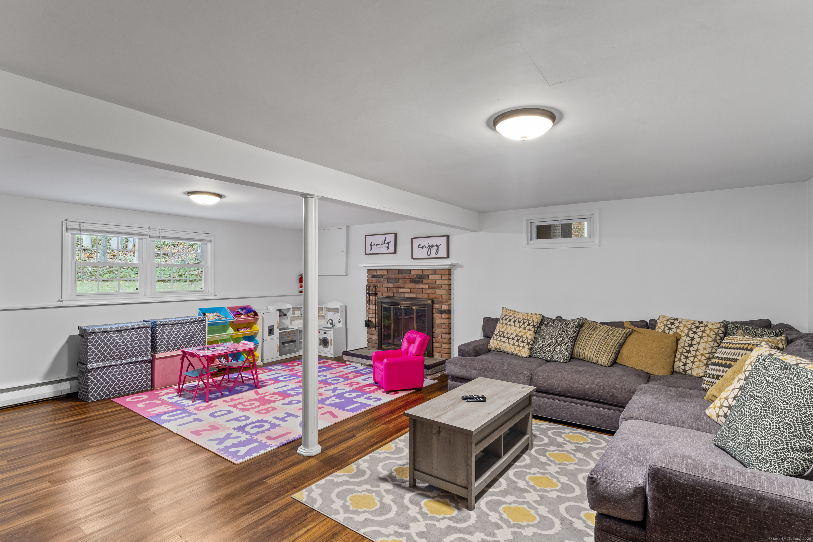8 Possum Ridge Road Newtown, CT 06470 - Photo 34 of 38 a living room with furniture and wooden floor