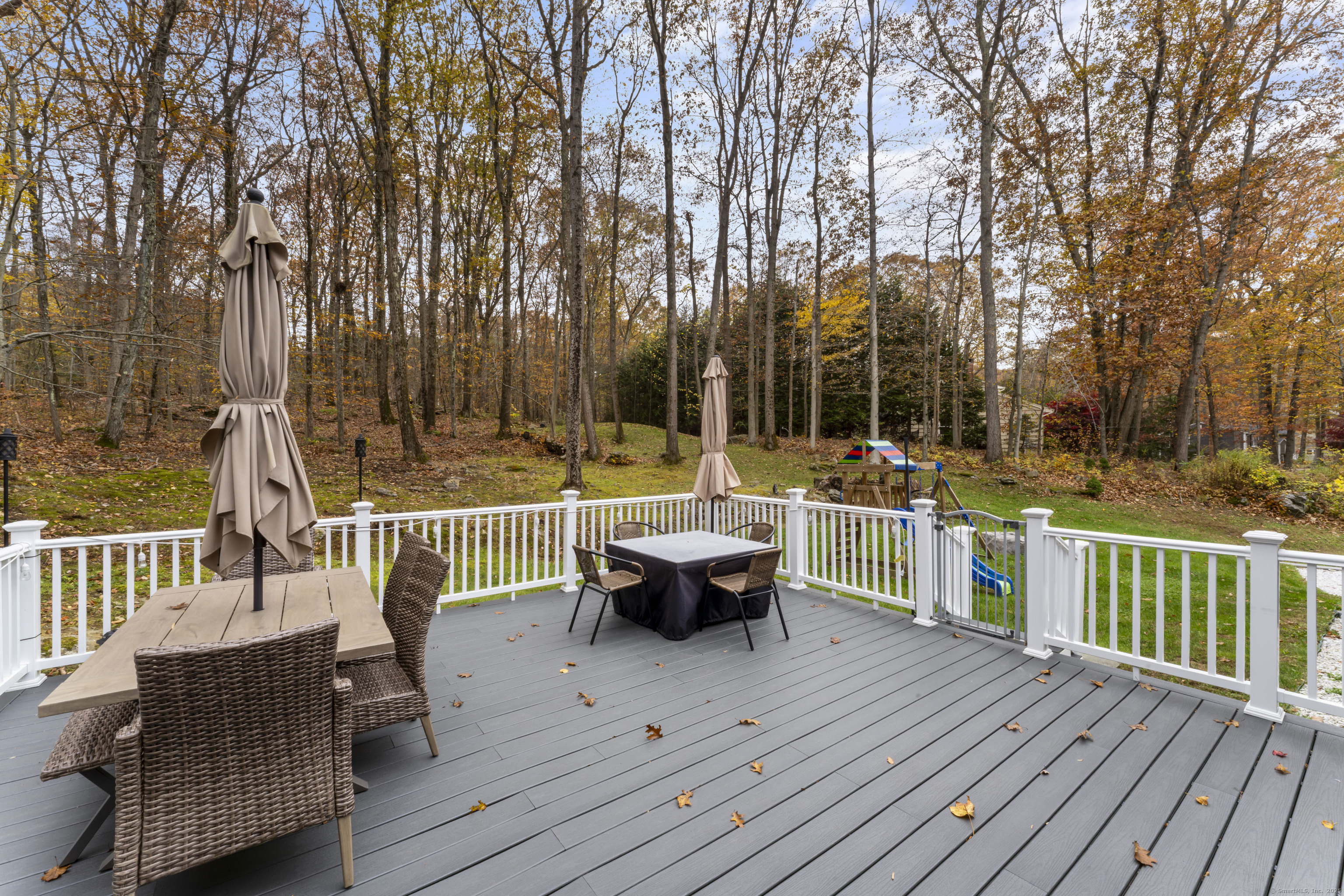 8 Possum Ridge Road Newtown, CT 06470 - Photo 37 of 38 a view of a deck with couches and wooden floor