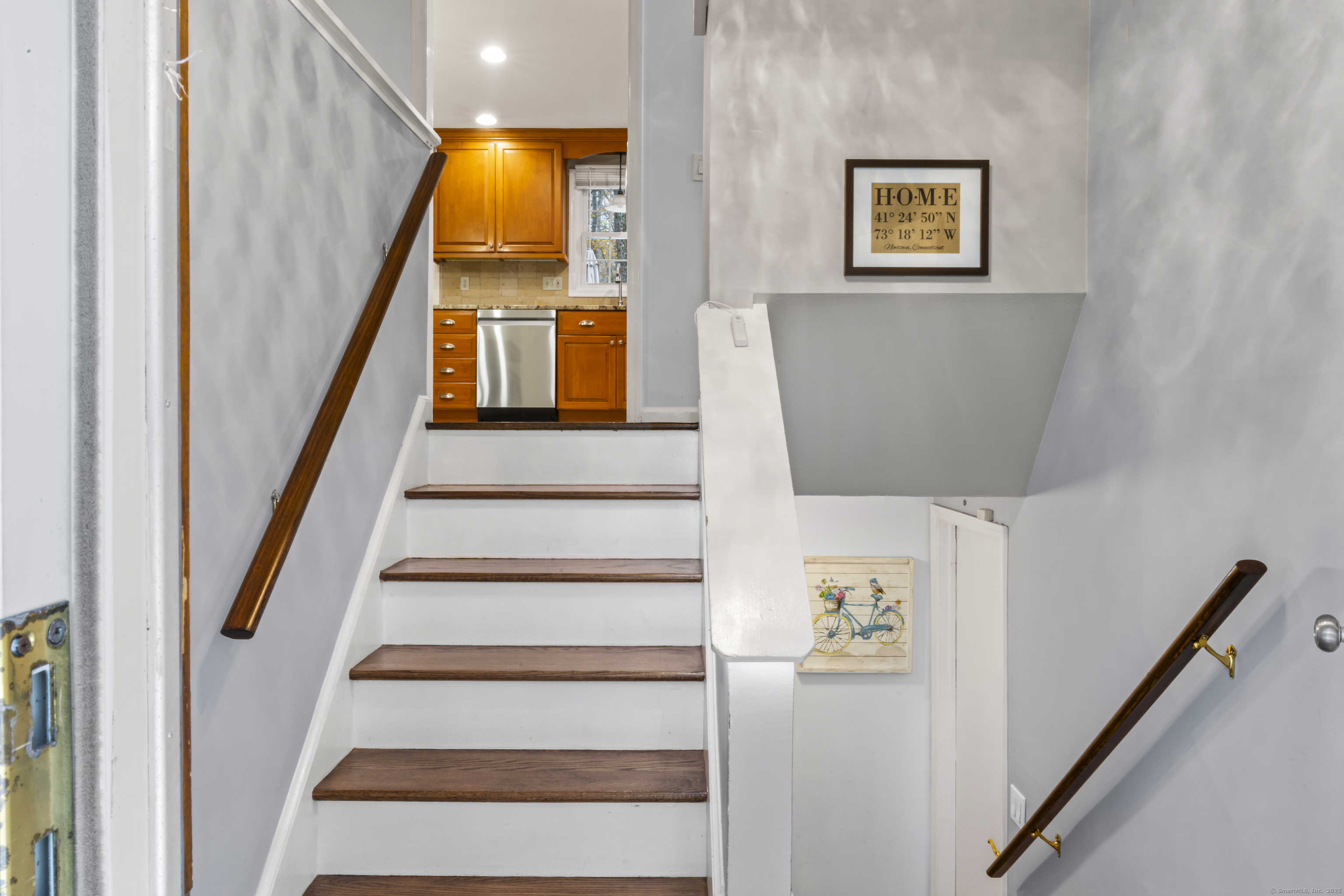 8 Possum Ridge Road Newtown, CT 06470 - Photo 5 of 38 a view of an entryway with wooden floor and door