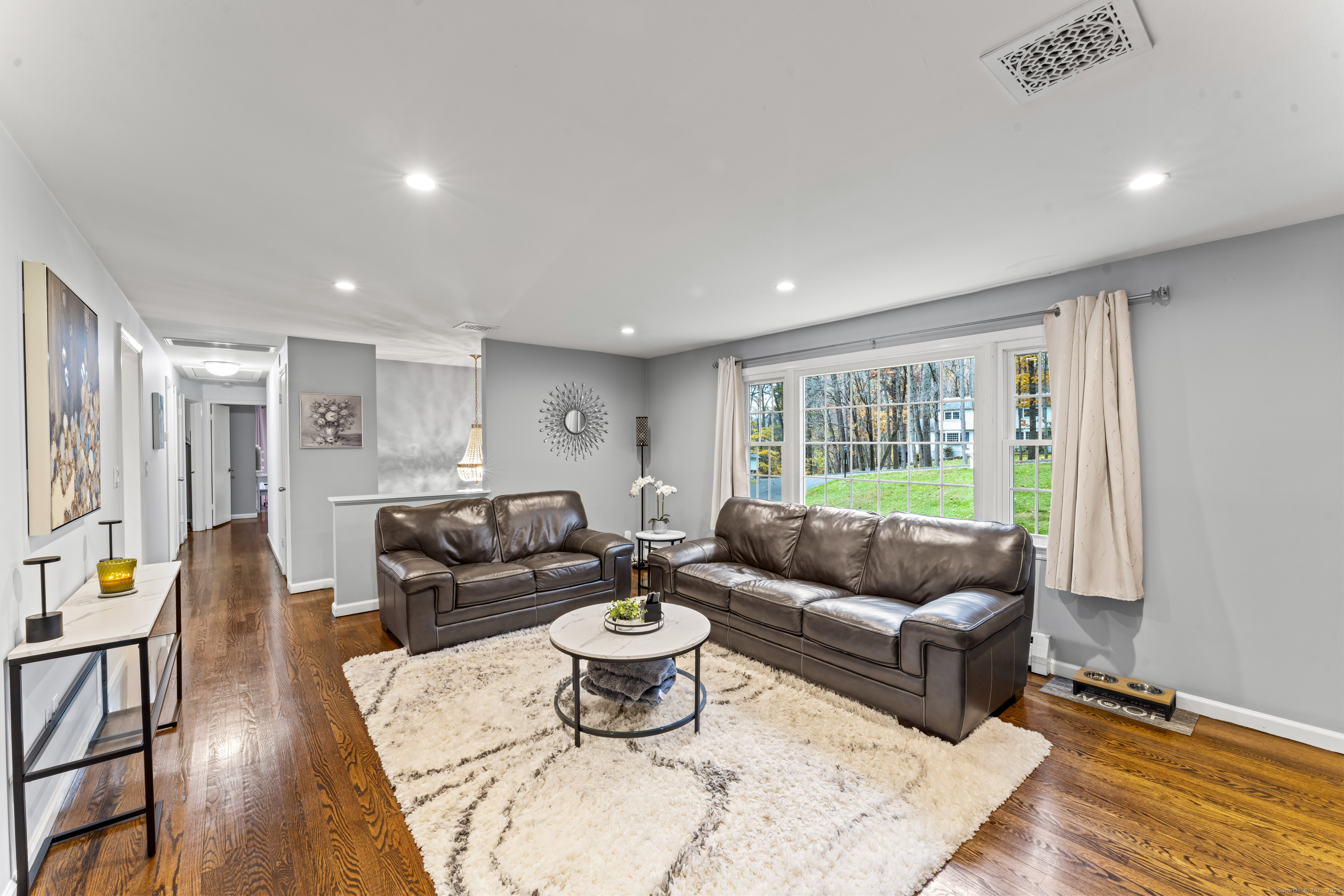 8 Possum Ridge Road Newtown, CT 06470 - Photo 7 of 38 a living room with furniture and a large window