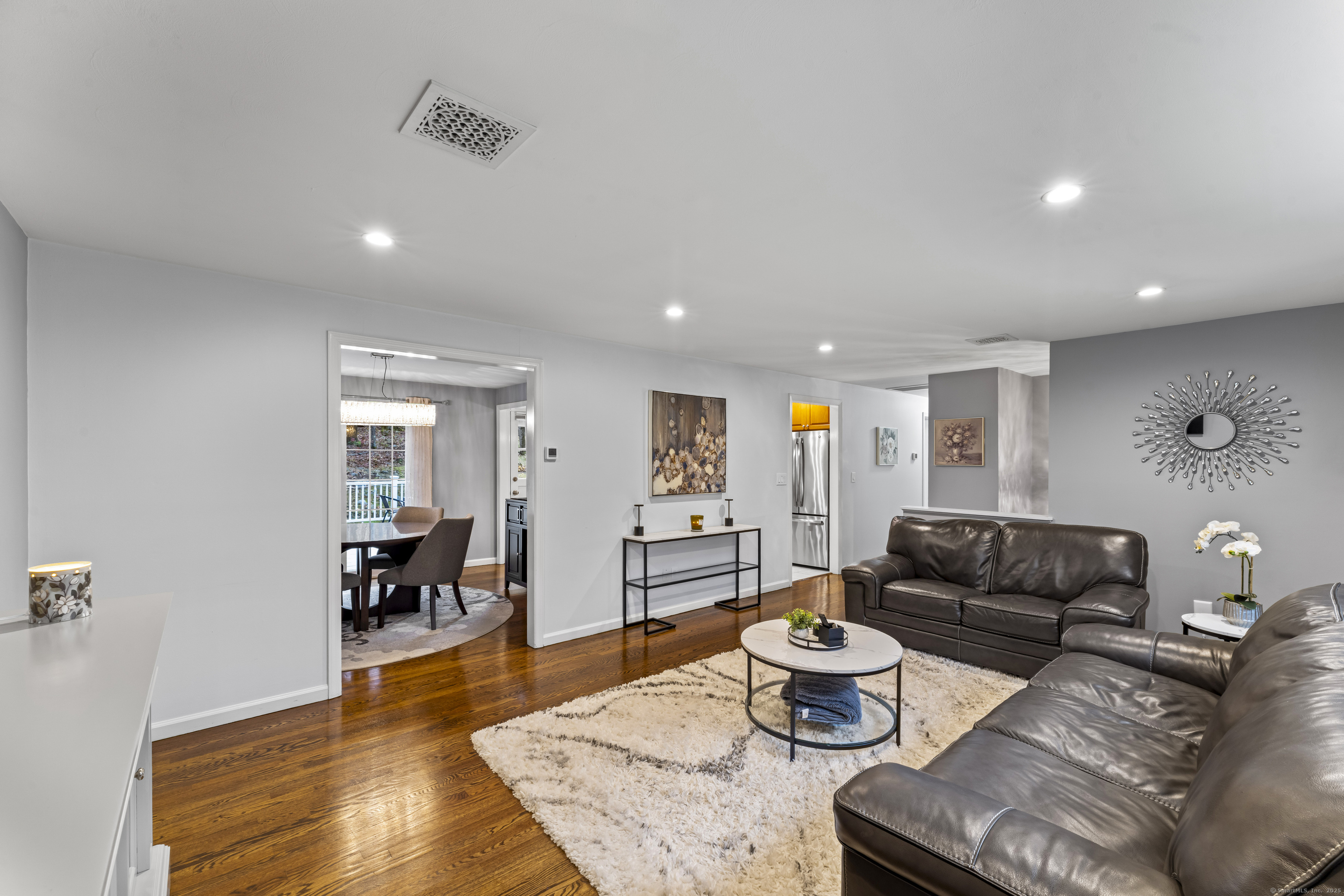8 Possum Ridge Road Newtown, CT 06470 - Photo 9 of 38 a living room with furniture and a table