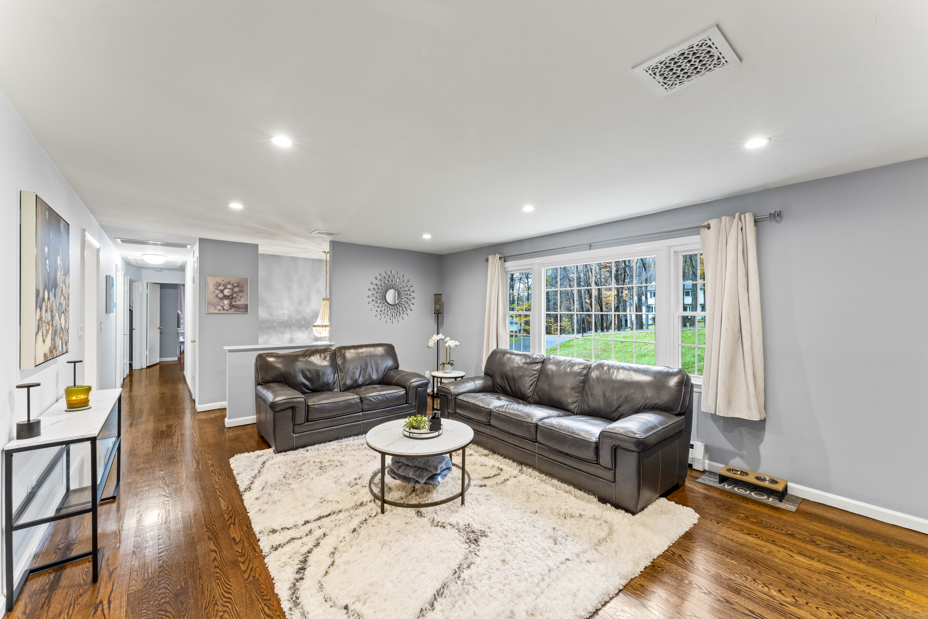 8 Possum Ridge Road Newtown, CT 06470 - Photo 10 of 38 a living room with furniture and a large window