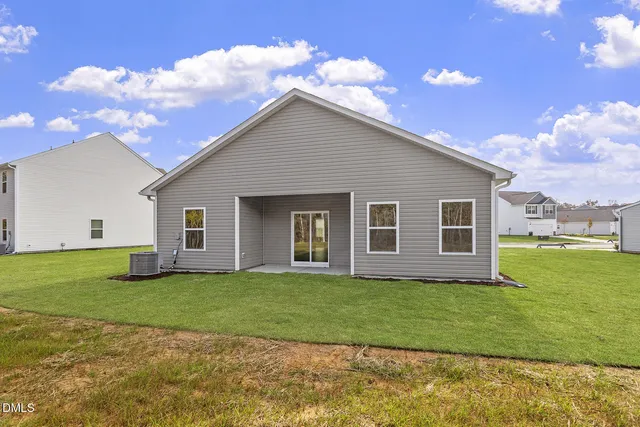 a house that has a big yard in front of it