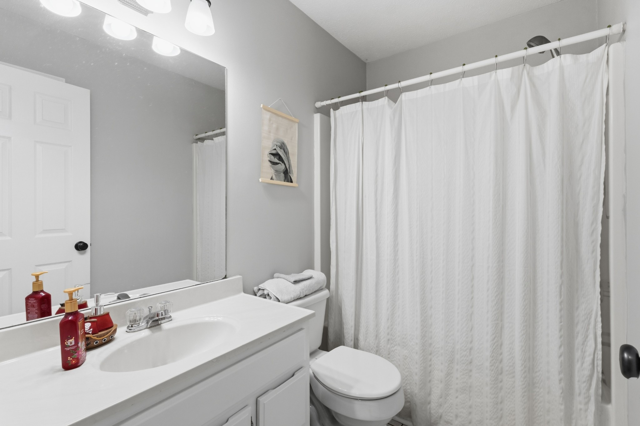 120 River Bend Road Hendersonville, TN 37075 - Photo 18 of 26 a bathroom with a sink a toilet and shower curtain