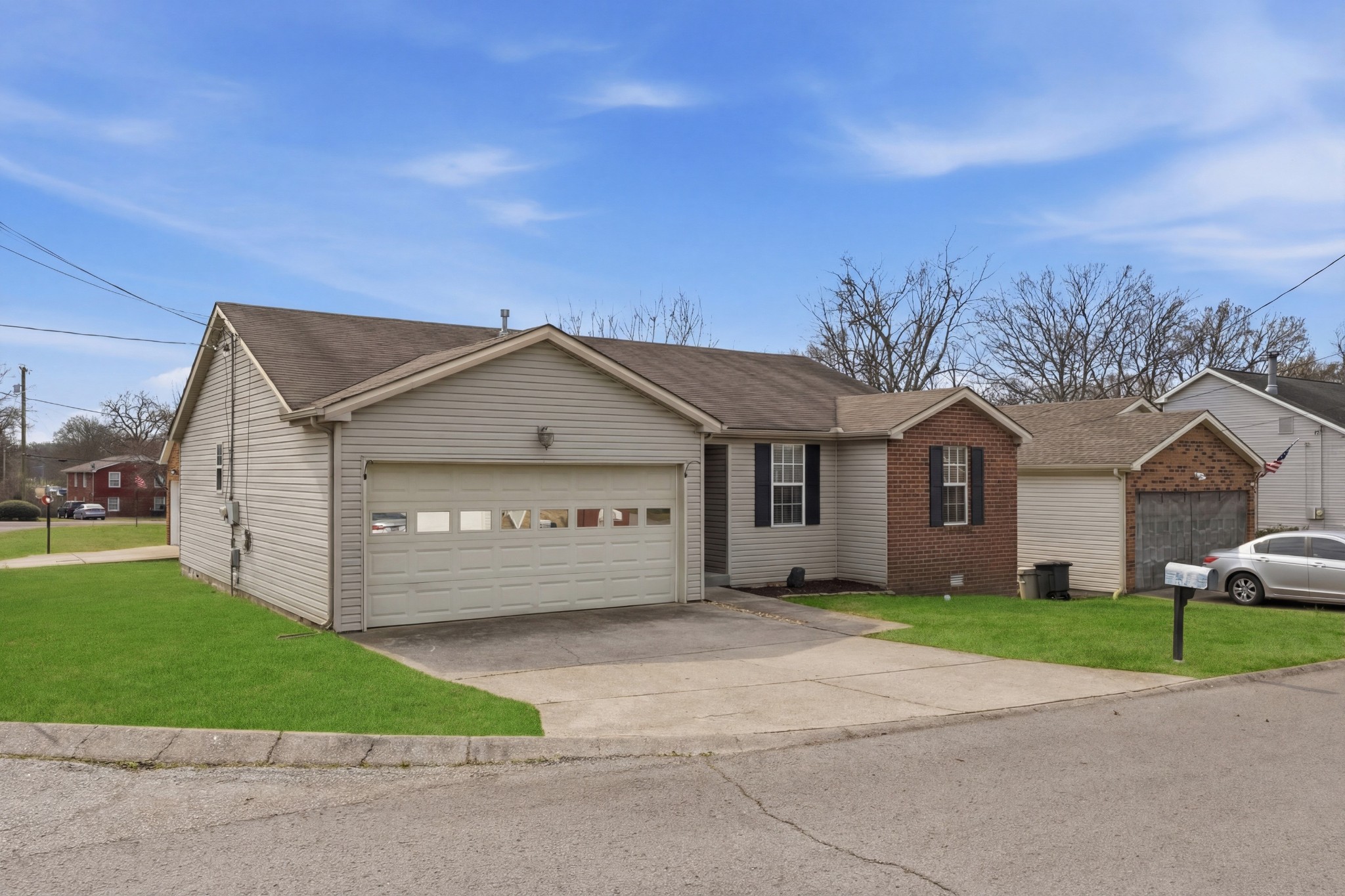 120 River Bend Road Hendersonville, TN 37075 - Photo 26 of 26 a front view of a house with a garden and trees