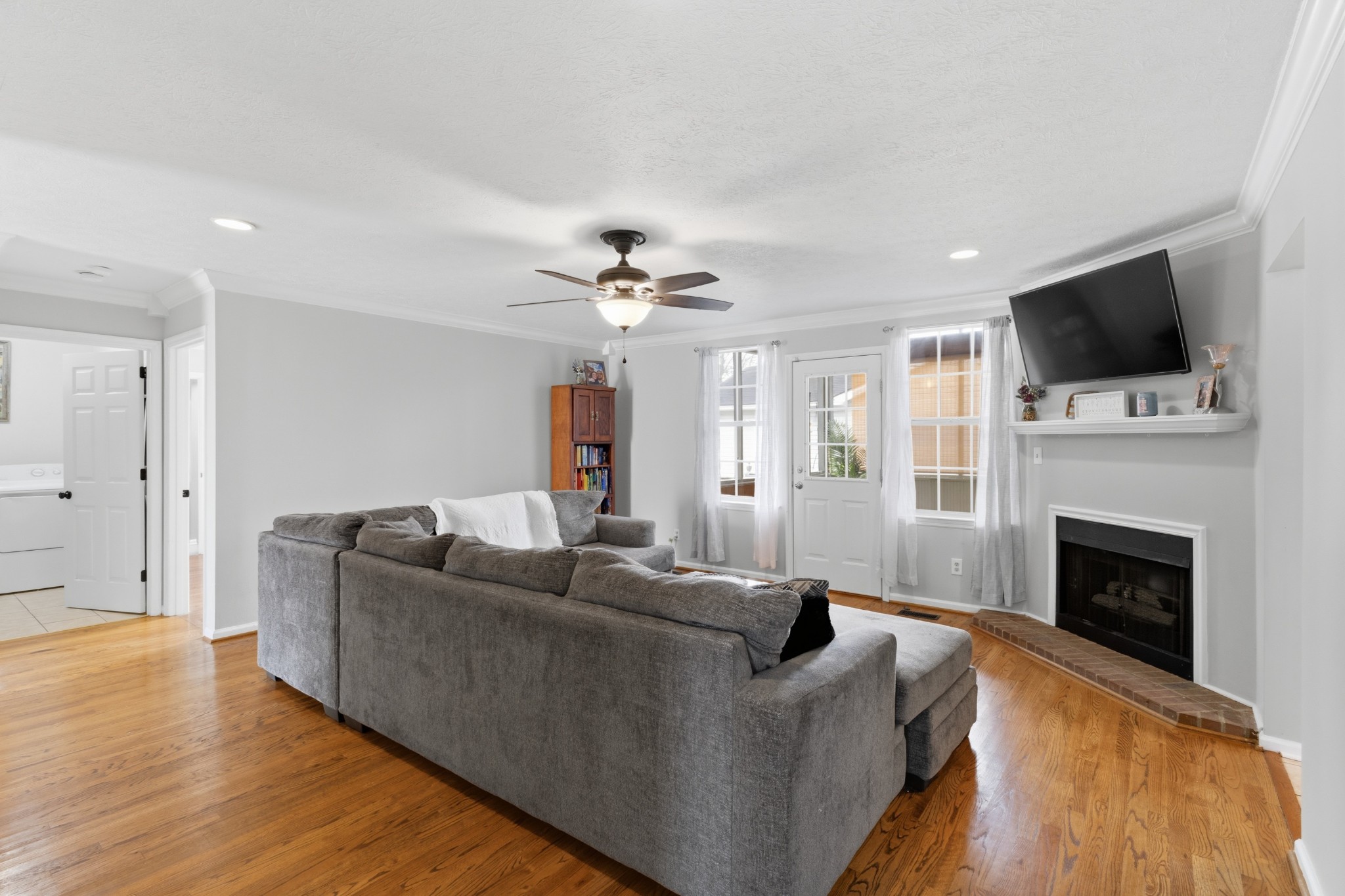 120 River Bend Road Hendersonville, TN 37075 - Photo 5 of 26 a living room with furniture a flat screen tv and a fireplace