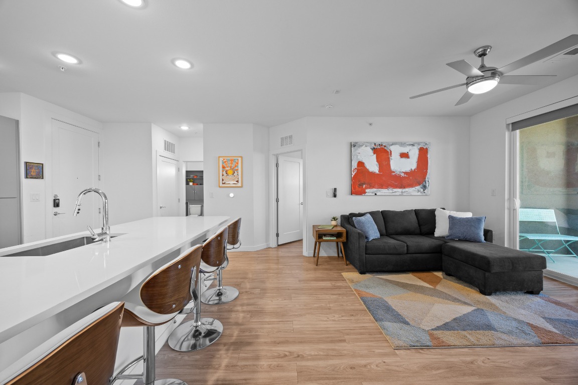4801 Springdale Road, Unit 1401 Austin, TX 78723 - Photo 18 of 40 a living room with furniture and a ceiling fan