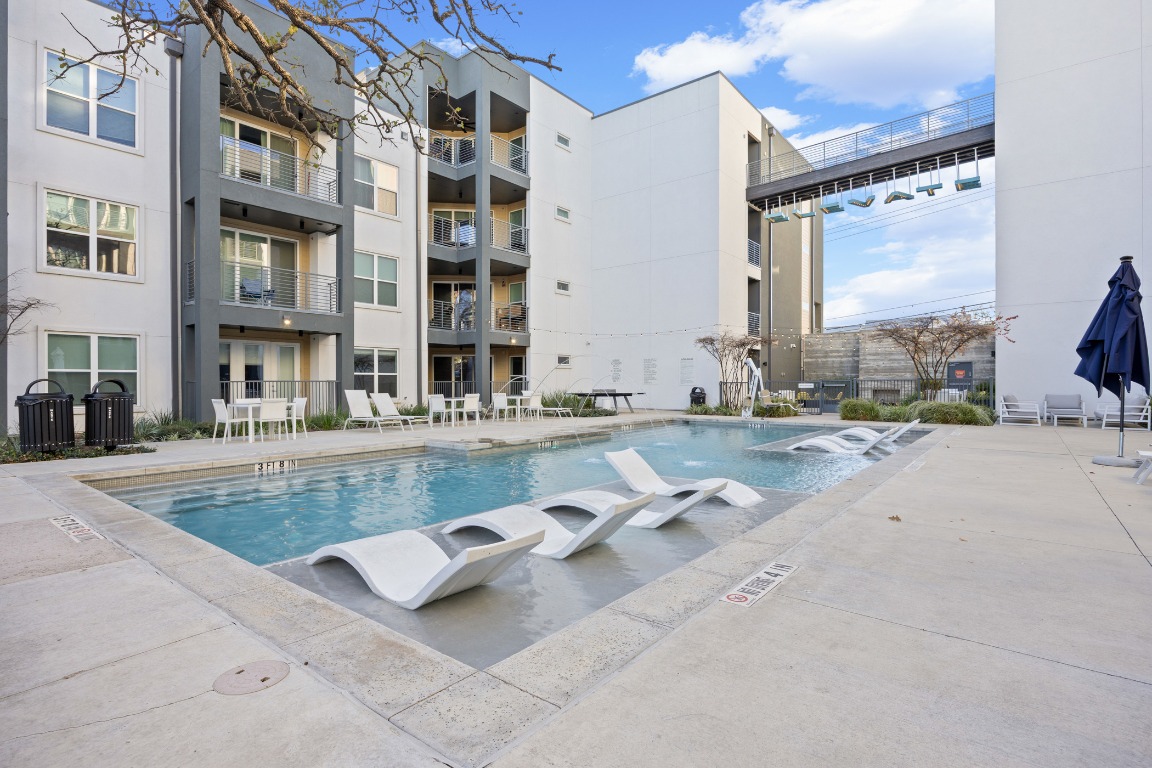4801 Springdale Road, Unit 1401 Austin, TX 78723 - Photo 32 of 40 a view of pool with outdoor seating