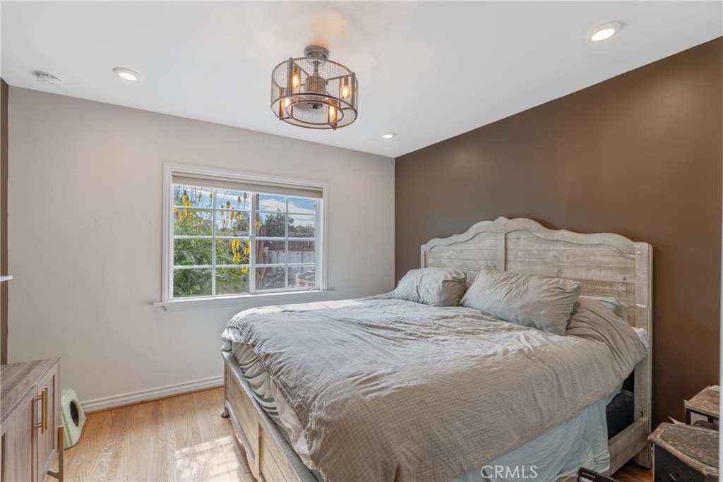 14844 Lull Street Van Nuys, CA 91405 - Photo 13 of 31 a bedroom with a bed and a window