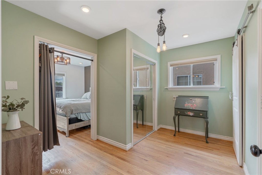 14844 Lull Street Van Nuys, CA 91405 - Photo 14 of 31 a view of an entryway with wooden floor and a bedroom