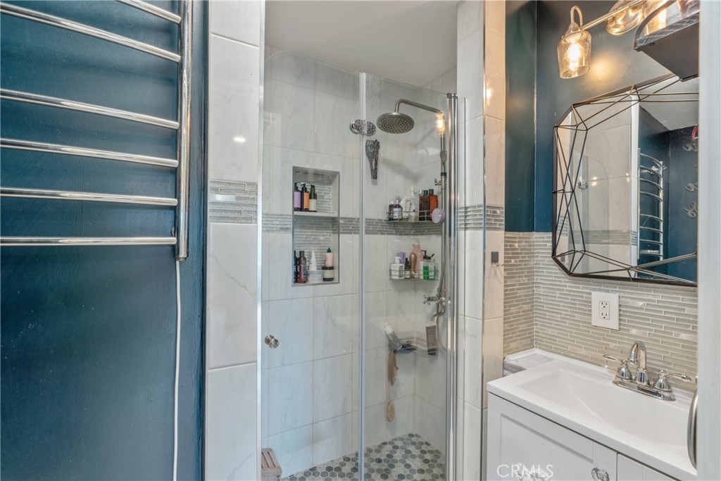 14844 Lull Street Van Nuys, CA 91405 - Photo 16 of 31 a bathroom with a shower and a sink