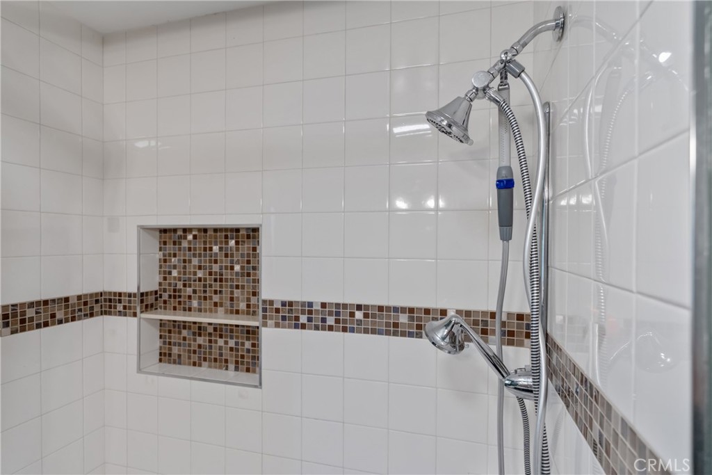 14844 Lull Street Van Nuys, CA 91405 - Photo 19 of 31 a bathroom with a bathtub and shower