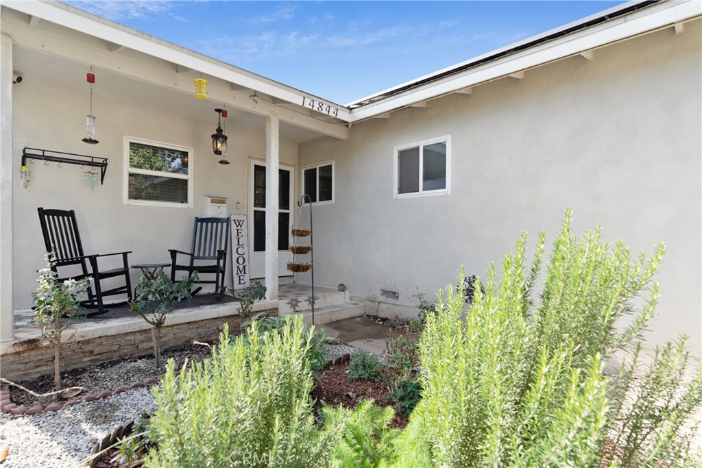 14844 Lull Street Van Nuys, CA 91405 - Photo 3 of 31 a backyard of a house with chairs