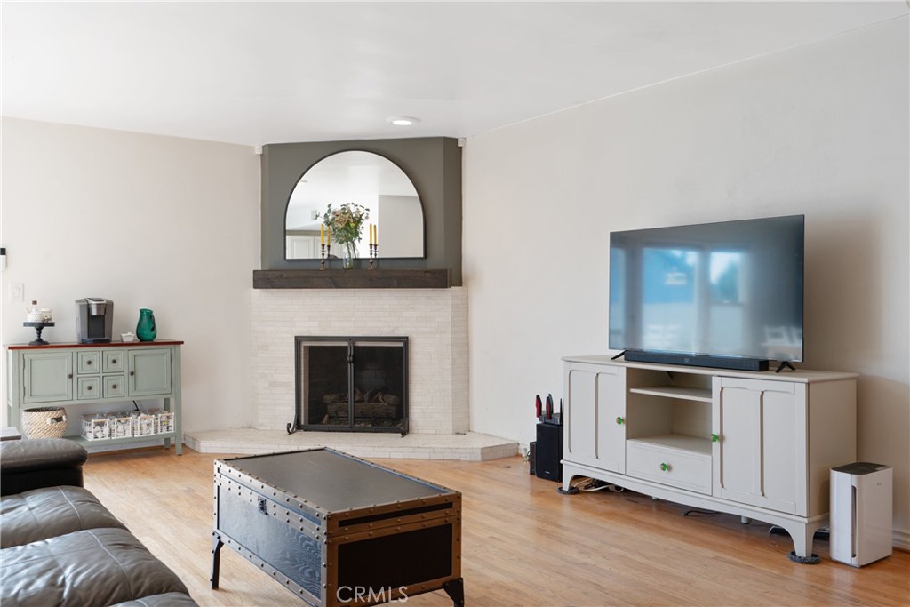 14844 Lull Street Van Nuys, CA 91405 - Photo 6 of 31 a living room with furniture and a fireplace