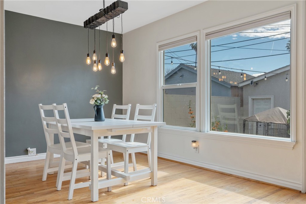 14844 Lull Street Van Nuys, CA 91405 - Photo 7 of 31 a view of a dining room with furniture and chandelier