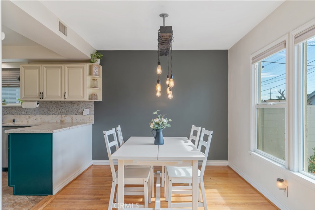 14844 Lull Street Van Nuys, CA 91405 - Photo 9 of 31 a dining room with a table chairs and entryway