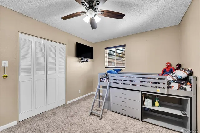 a kitchen with a stove and a chandelier