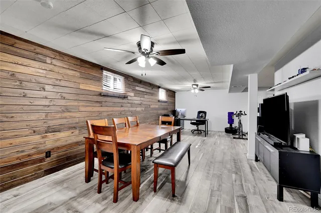 a view of a livingroom with furniture and a flat screen tv
