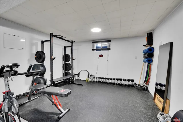 a bedroom with a bed and a night stand