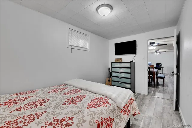 a white toilet sitting next to a shower