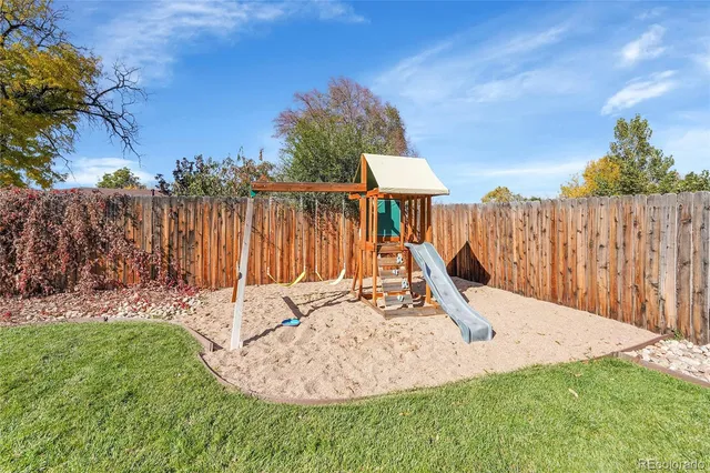 a view of a house with a yard and garage