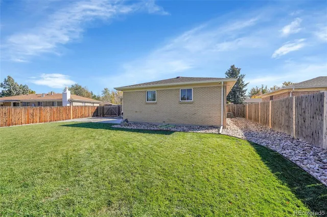 a view of a backyard with a garden and plants