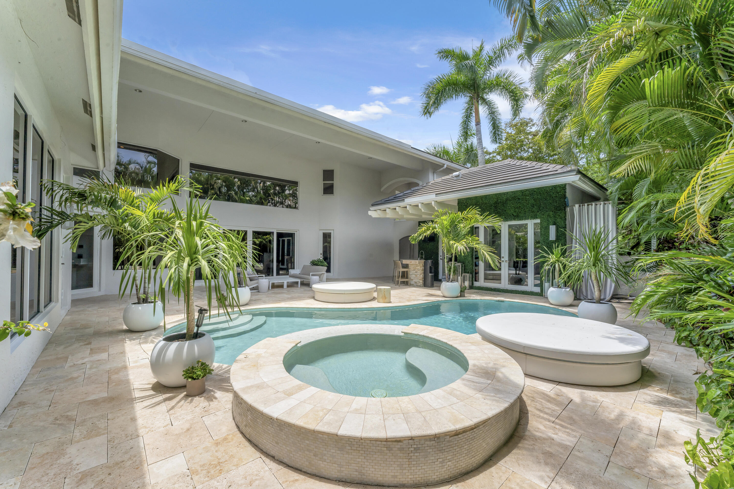 3156 Northwest 61st Street Boca Raton, FL 33496 - Photo 38 of 46 a view of a swimming pool with a patio