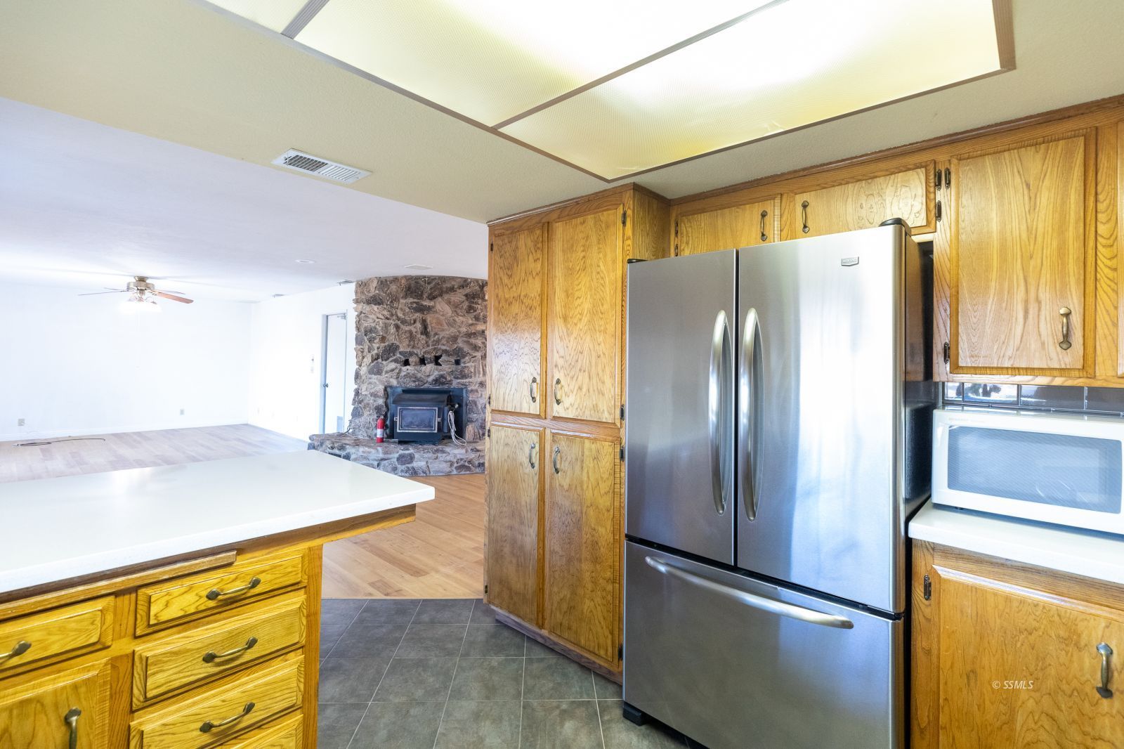361 North Wildflower Street Ridgecrest, CA 93555 - Photo 16 of 39 a kitchen with stainless steel appliances granite countertop a refrigerator and a stove