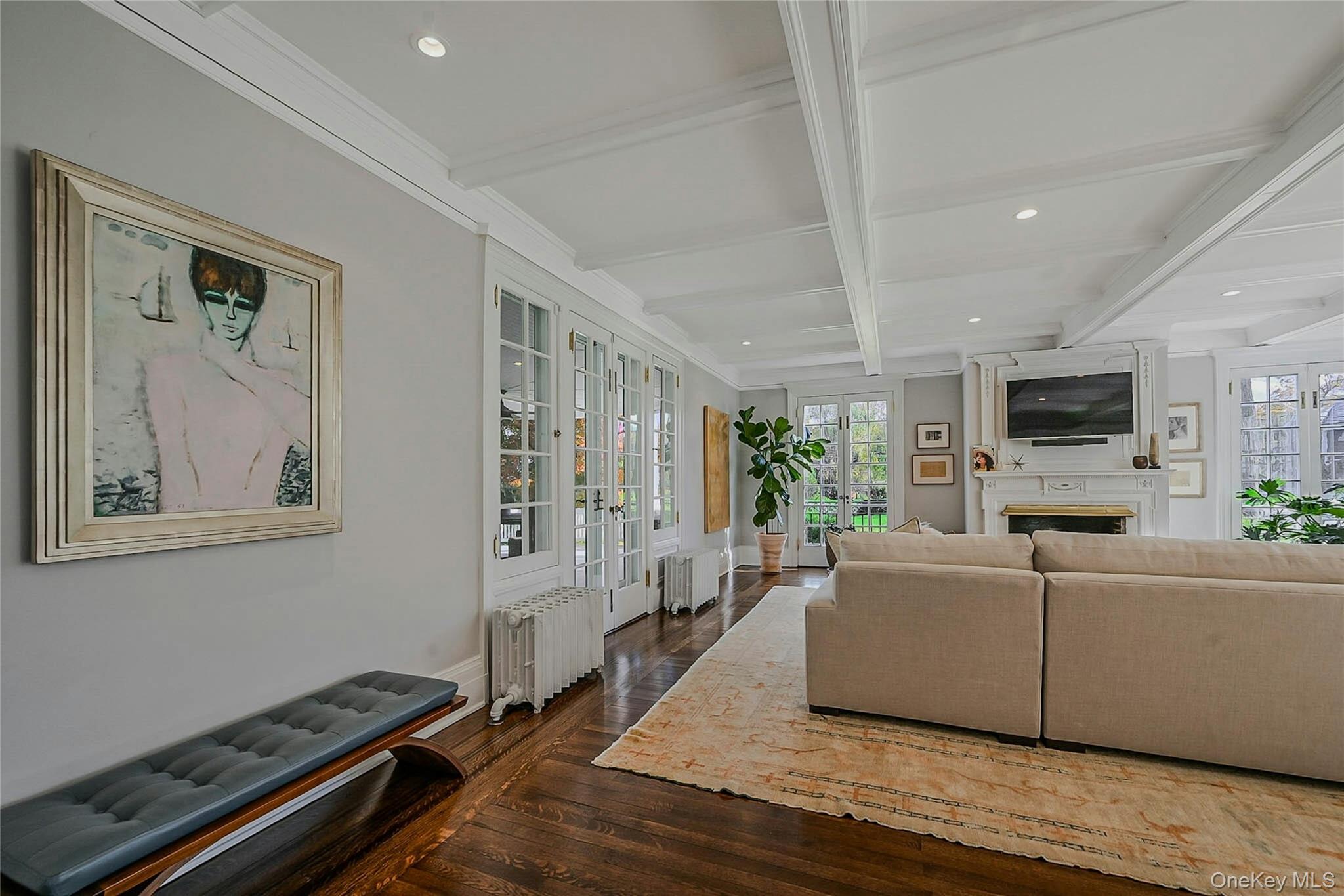 24 Harbor Hill Road Huntington Bay, NY 11743 - Photo 14 of 46 a living room with furniture and a flat screen tv