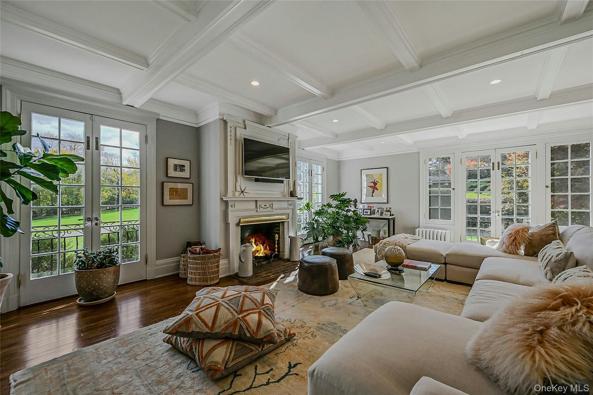 24 Harbor Hill Road Huntington Bay, NY 11743 - Photo 16 of 46 a living room with furniture or couch and a fireplace