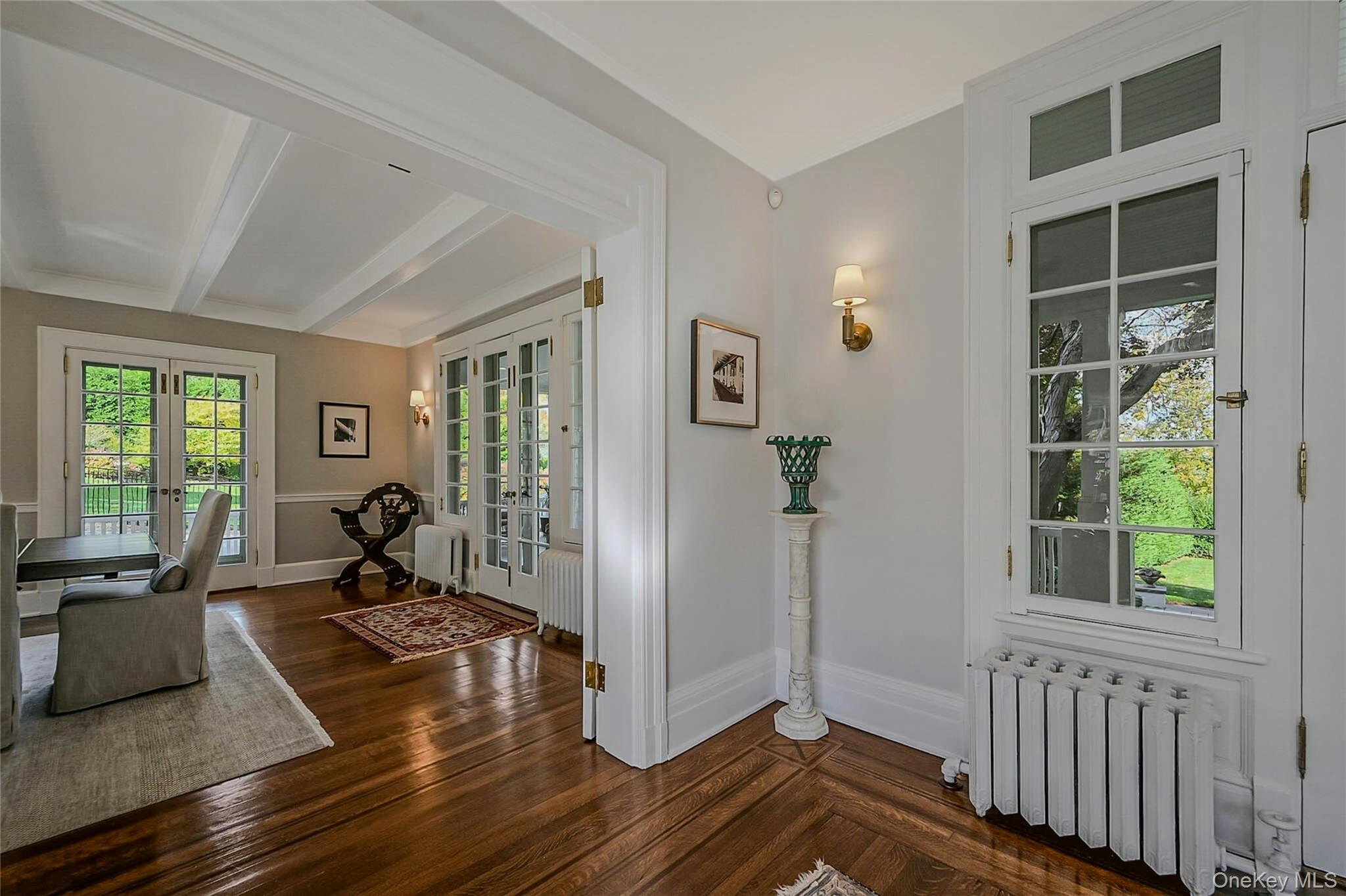 24 Harbor Hill Road Huntington Bay, NY 11743 - Photo 17 of 46 a view of a livingroom with furniture hardwood floor and a large window
