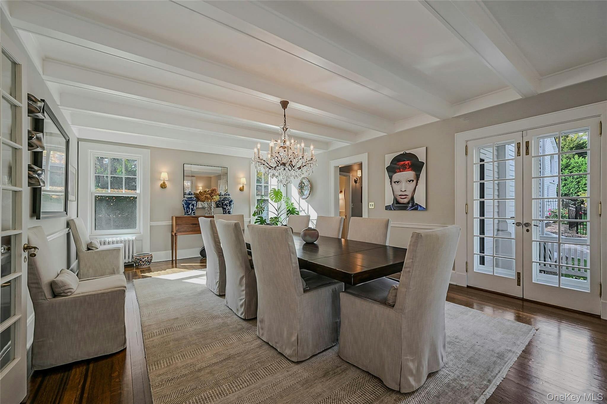 24 Harbor Hill Road Huntington Bay, NY 11743 - Photo 18 of 46 a dining room with furniture a chandelier and wooden floor