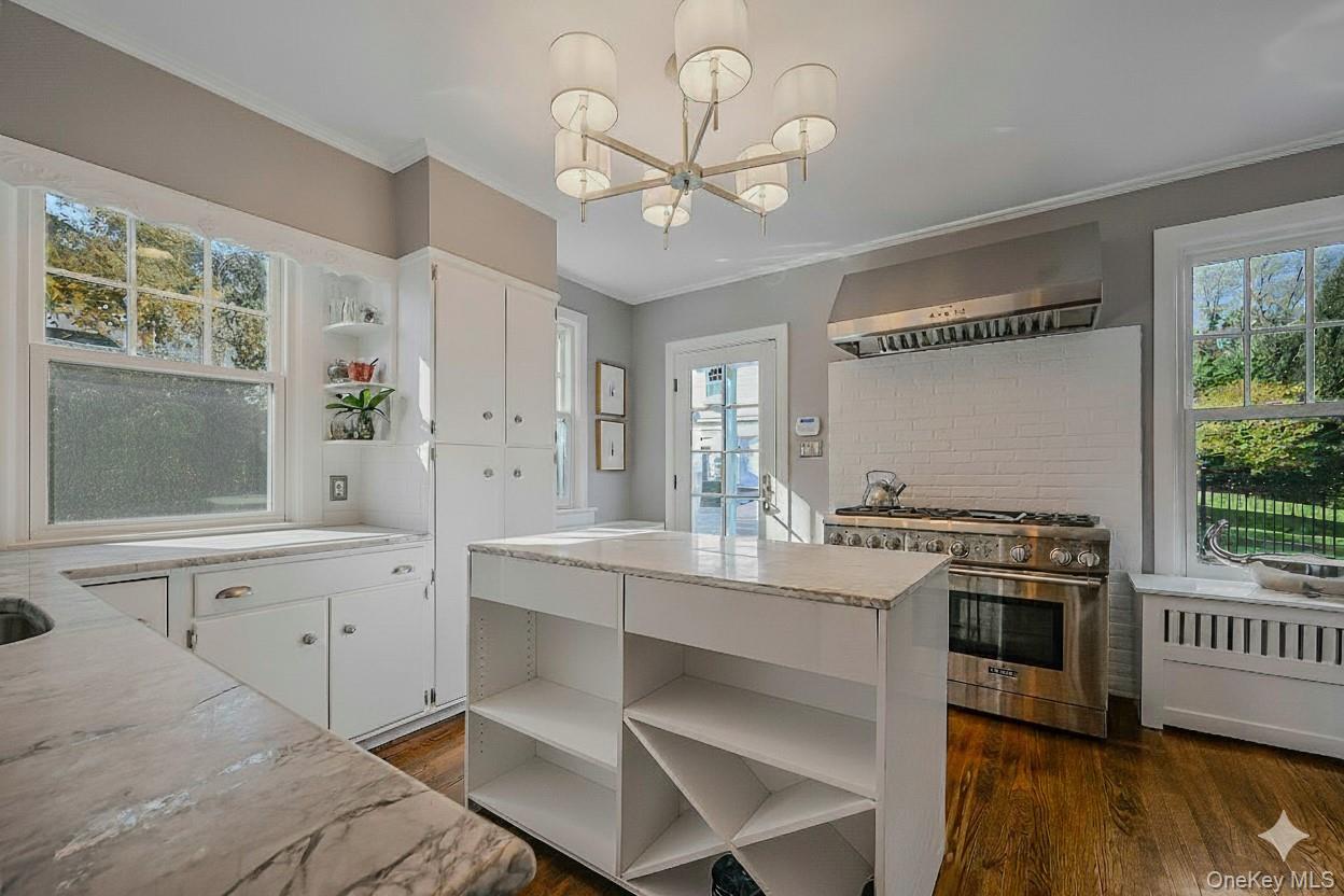 24 Harbor Hill Road Huntington Bay, NY 11743 - Photo 21 of 46 a kitchen with a stove a sink and a window