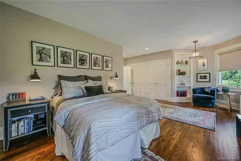 a spacious bedroom with a bed and a couch