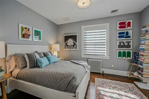 a bedroom with bed and a window