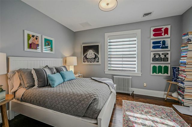 a bedroom with bed and a window