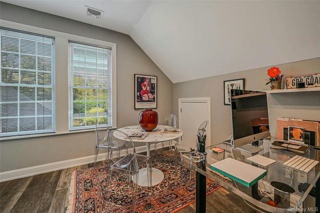 a work room with furniture and a window